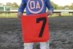 Jockey Paco Lopez holds 7 saddle towel after scoring a Monmouth Park record 7th win in a day in the last race at  Monmouth Park in Oceanport, New Jersey aboard Tycoon Cat on Saturday May 17, 2014. Photo By Bill Denver/EQUI-PHOTO